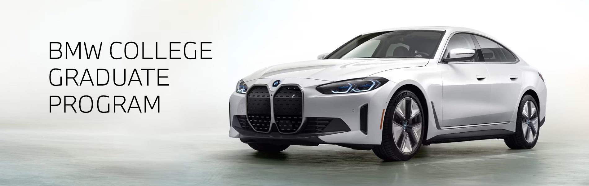 White BMW i4 parked. BMW College Graduate Program. | BMW Showcase 2 in Derwood MD