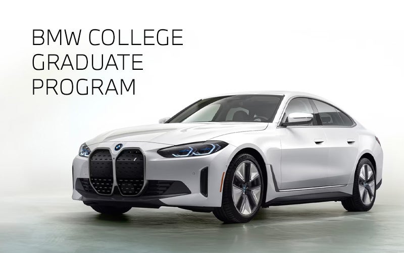 White BMW i4 parked. BMW College Graduate Program. | BMW Showcase 2 in Derwood MD